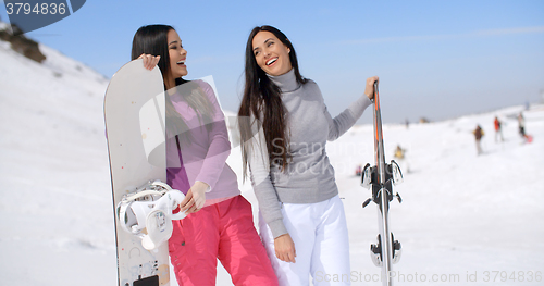 Image of Two attractive female friends at a ski resort