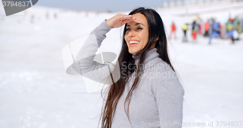 Image of Gorgeous smiling young woman at a ski resort