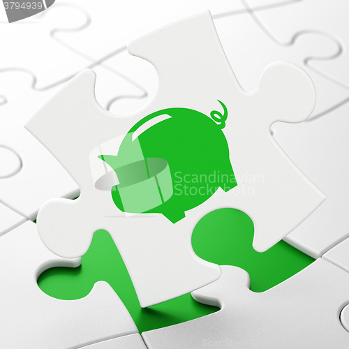 Image of Money concept: Money Box on puzzle background