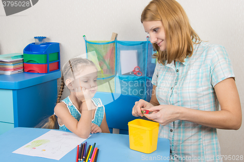 Image of The five-year child waits mum undermine pencil