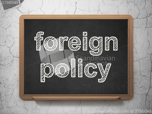 Image of Politics concept: Foreign Policy on chalkboard background