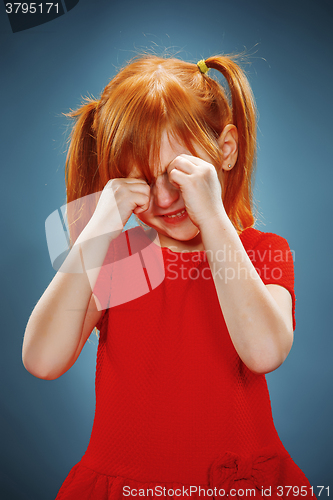 Image of Portrait of a little girl. She is crying