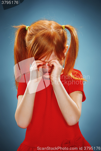 Image of Portrait of a little girl. She is crying