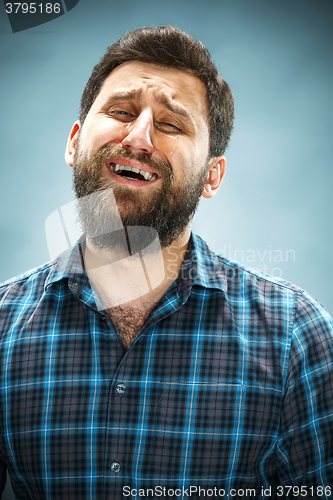 Image of The crying man with tears on face closeup