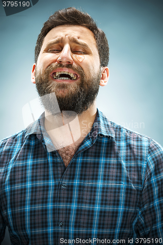 Image of The crying man with tears on face closeup