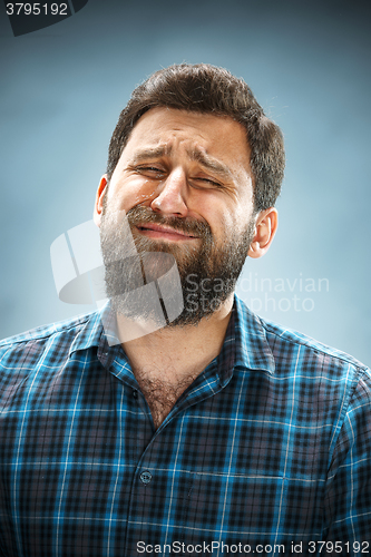 Image of The crying man with tears on face closeup