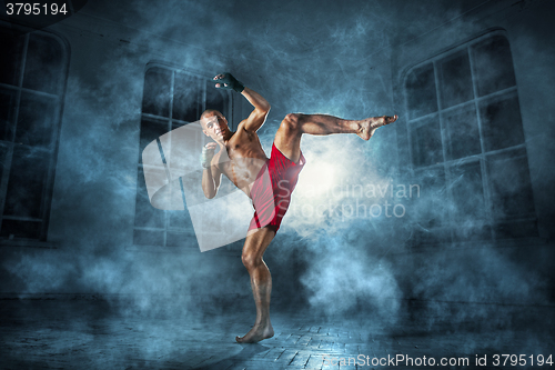 Image of The young  man kickboxing 