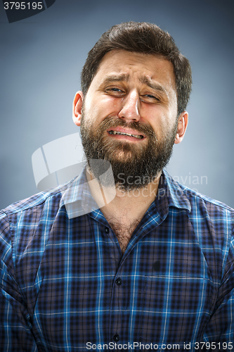 Image of The crying man with tears on face closeup