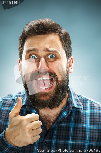 Image of Closeup headshot portrait, happy handsome business man in blue shirt