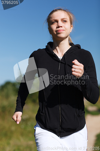 Image of Girl running in the park. Close up