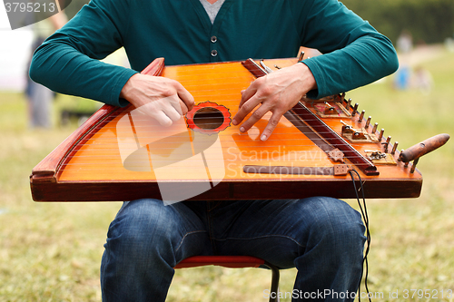 Image of Folk musician playing gusli