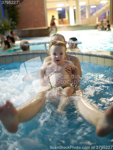 Image of Mother with son in spa bath