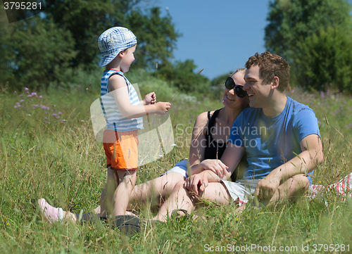 Image of Family outdoor on a bright summer day