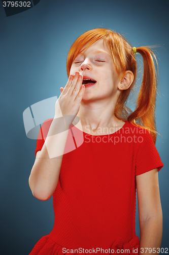 Image of Beautiful portrait of a little yawning girl 