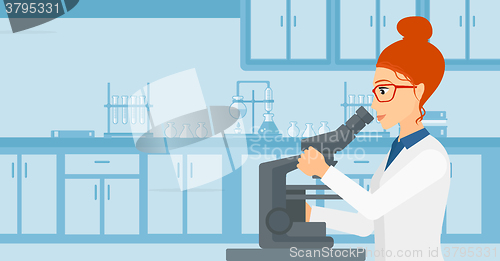 Image of Laboratory assistant with microscope.