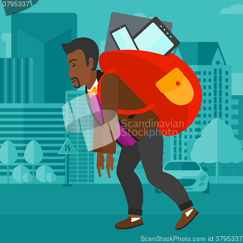 Image of Man with backpack full of devices.