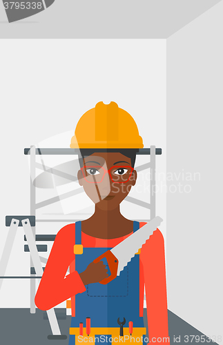 Image of Smiling worker with saw.