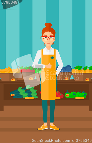 Image of Friendly supermarket worker.