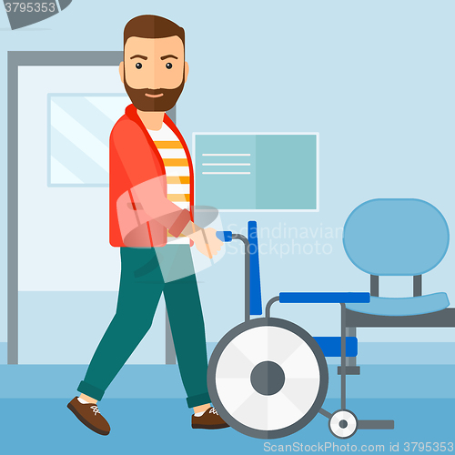 Image of Man pushing wheelchair.
