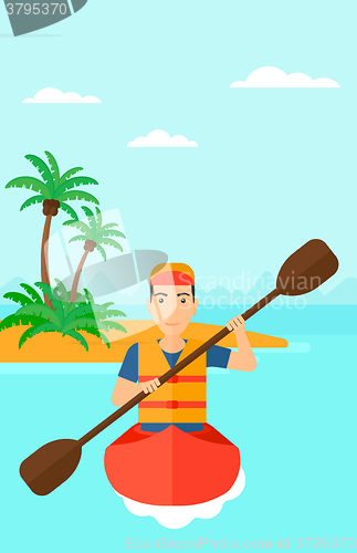 Image of Man riding in canoe.