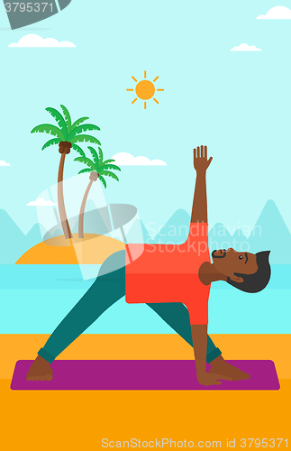 Image of Man practicing yoga.