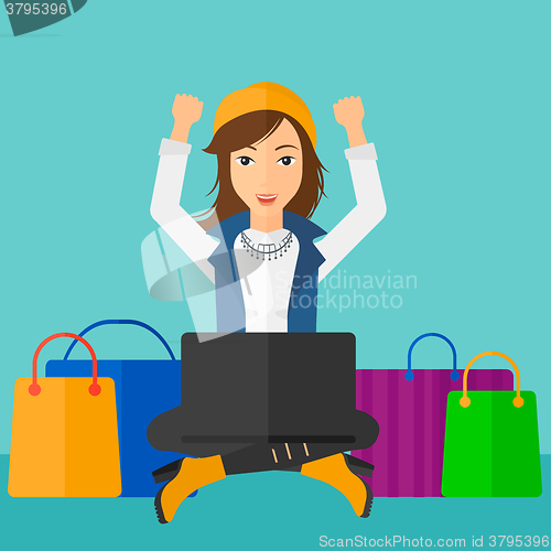 Image of Woman making purchases online.