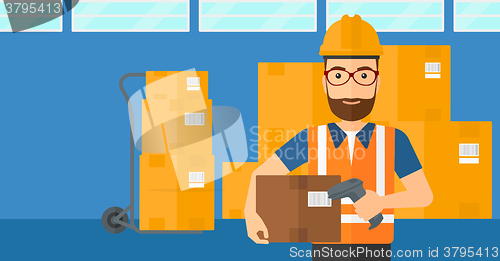 Image of Worker checking barcode on box.