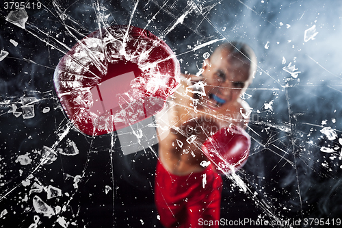 Image of The boxer crushing a glass