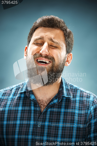 Image of The crying man with tears on face closeup