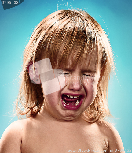 Image of Portrait of a little girl. She is crying