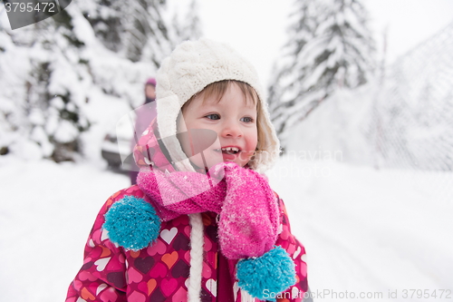 Image of little girl at snowy winter day