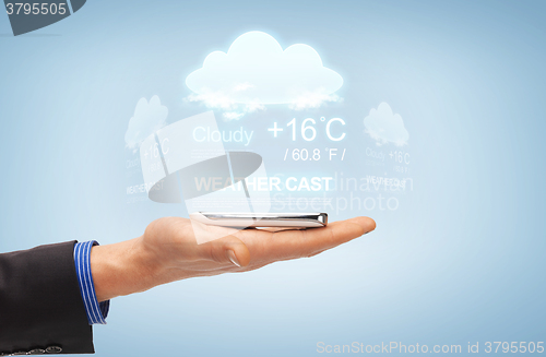 Image of male hand with smartphone and weather cast