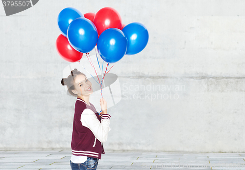 Image of happy teenage girl with helium balloons