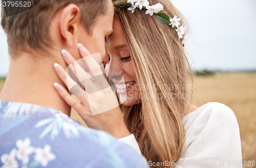 Image of happy smiling young hippie couple outdoors