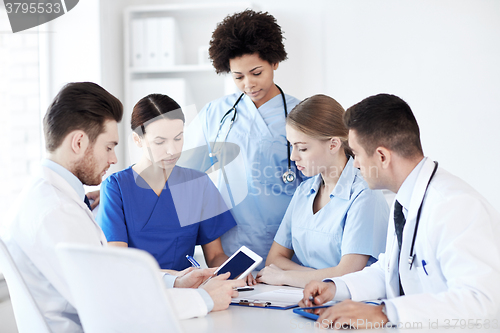 Image of group of doctors with tablet pc at hospital