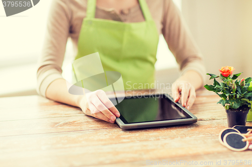 Image of close up of woman or gardener with tablet pc