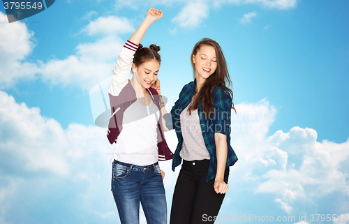 Image of happy smiling pretty teenage girls dancing