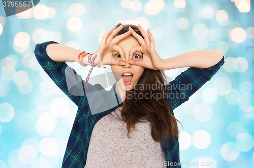 Image of happy teenage girl making face and having fun