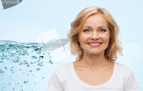 Image of smiling woman in blank white t-shirt