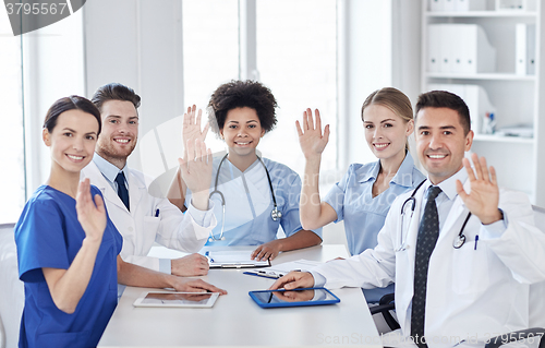 Image of group of happy doctors meeting at hospital office