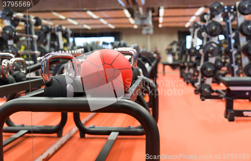 Image of medicine ball and sports equipment in gym