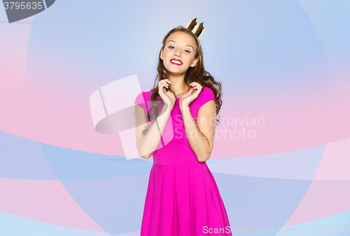 Image of happy young woman or teen girl in pink dress