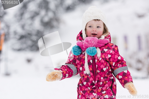 Image of little girl at snowy winter day