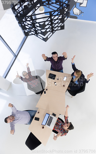 Image of aerial view of business people group on meeting