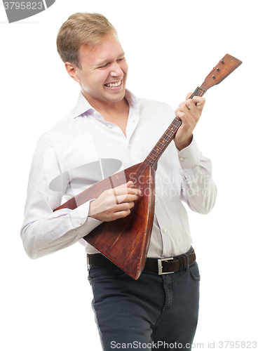 Image of Excited young man playing balalaika, isolated on white