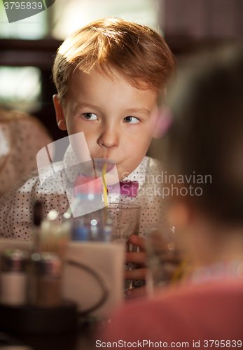 Image of Little boy drinking with tubule