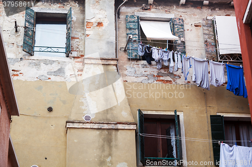 Image of Old grungy building with linen outside