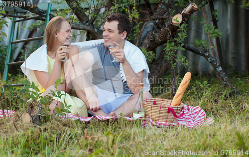 Image of Young couple on picnic in the countryside