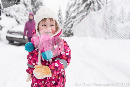 Image of little girl at snowy winter day