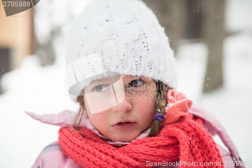 Image of little girl at snowy winter day